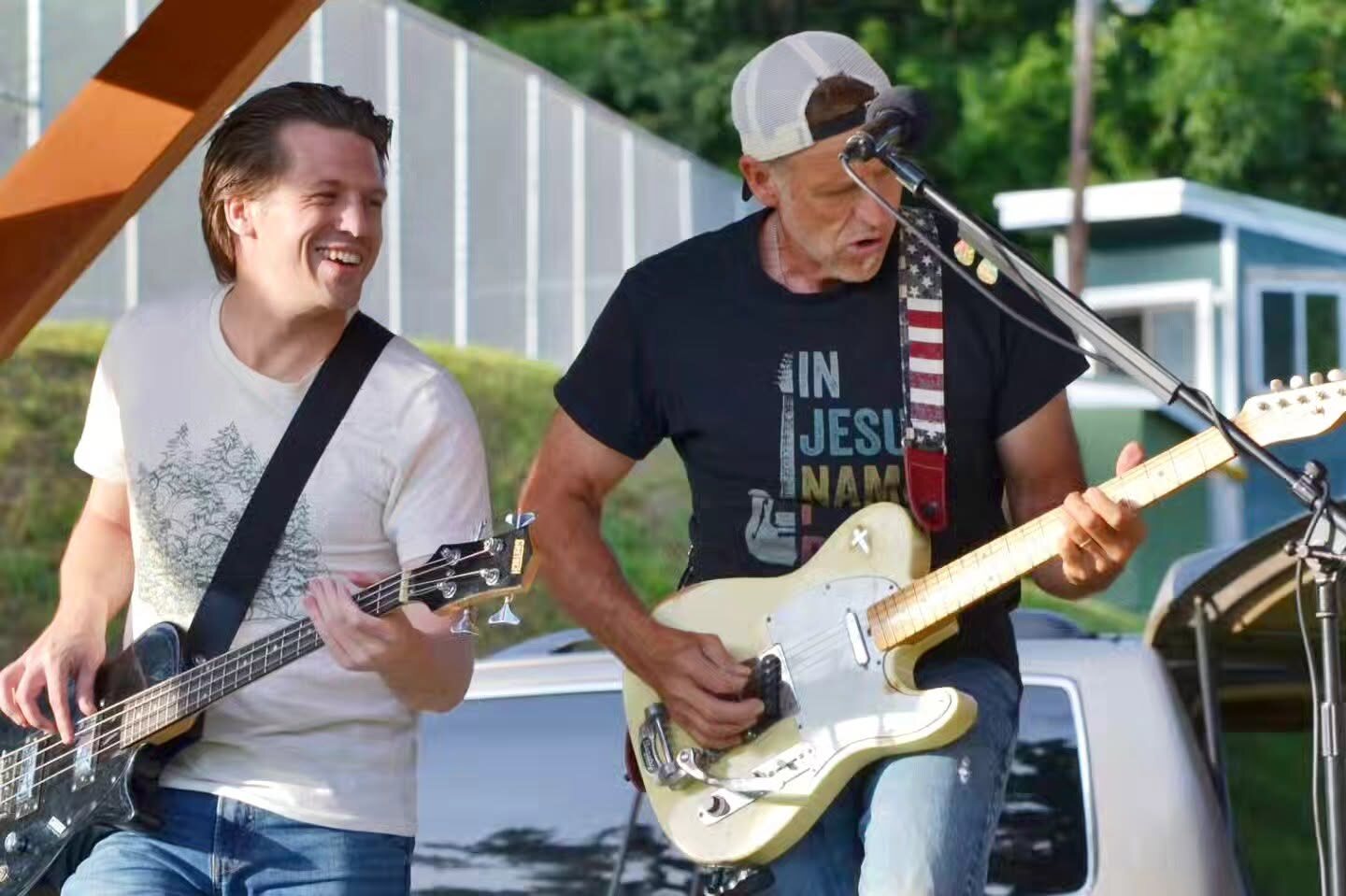 Tom Jordan and Jules Rancourt performing together outdoors