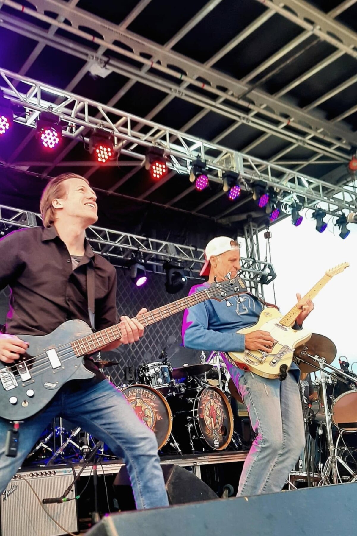 Tom Jordan and Jules Rancourt performing on a festival stage